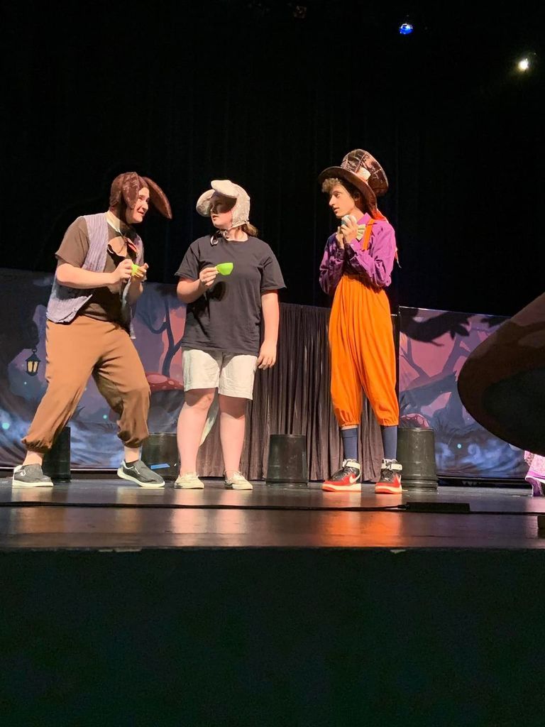 Students performing on stage.